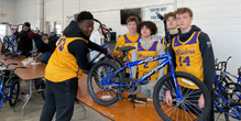 CDH Students Assemble Bikes at Mauer Chevrolet for Toys for Tots