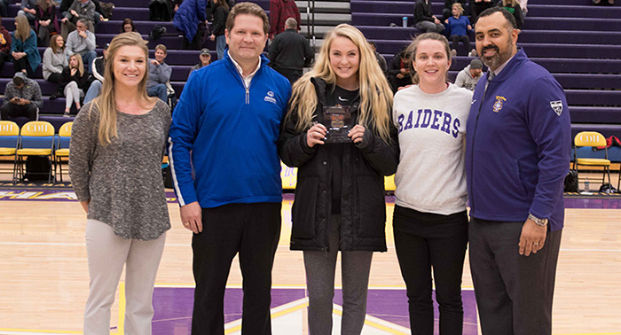 Pictured (L-R): Halley Barnes (on behalf of Allstate), Tom Kruse (local Allstate agent), Paige Peltier, coach Rosie Malone-Povolny, AD Phil Archer