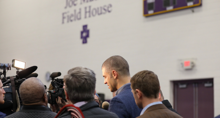 Joe Mauer'01 is surrounded by media after the Twins announce that his jersey number 7 will be retired.