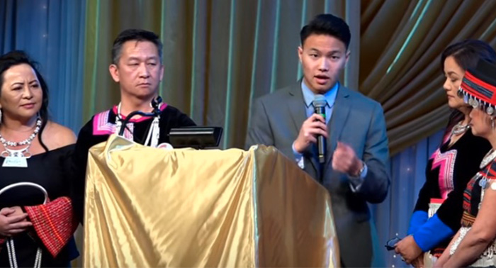 Leon Xiong read his winning essay to thousands of Hmong who gathered to celebrate the New Year.