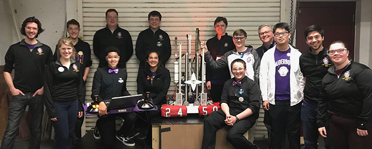 Back row, left to right: Mentor Brendan Tickle '16, Zach Maher '19, Mentor Walter Harrier, Thomas Cunningham '20, Dan Rueter '21, John Anderson '20, President Frank Miley, Xuan An Le '21, Coach Nick Montelibano '12, Lauren Mohs '18. Front Row, left to right: Coach Lexie Klaus Montelibano '12, Ian Machado '20, Callahan Rios '19, Seamus Dougherty '22