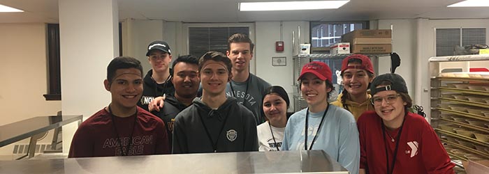 Edmundo Villalva Lijo '19, Dylan Macke '21, Harry Olander '20, Riley Christensen '19, Victor Cox '19, Isabel Basurto Poferl '20, Kiana Kotasek '19, Kiera DeGroot '20, and Zoe Schearer '20 at Dorothy Day.