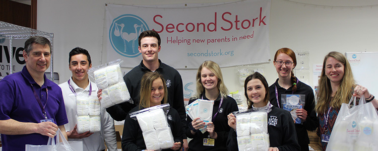 Religion Teacher Tim Teuber, Simon Baumberger '20, Danny McGraw '20, Stella Dolan '20, Ellie Murphy '20, Ava Monacelli '20, Monica Calkins '20 and St. Joseph Worker Ceara Curry volunteered at Second Stork.