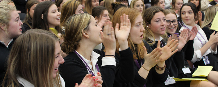 Students cheer for their classmates at the Honors Award Assembly.