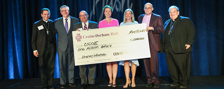 Bishop Andrew Cozzens, Auxilary Bishop and CDH President Frank Miley, CDH Board of Directors Chair Brian McMahon '87, CSCOE President Gail Dorn, CDH Board Member Katie Stewart, CDH Board Member Michael Cole, and Archbishop Bernard Hebda at the CSCOE Bash May 11.