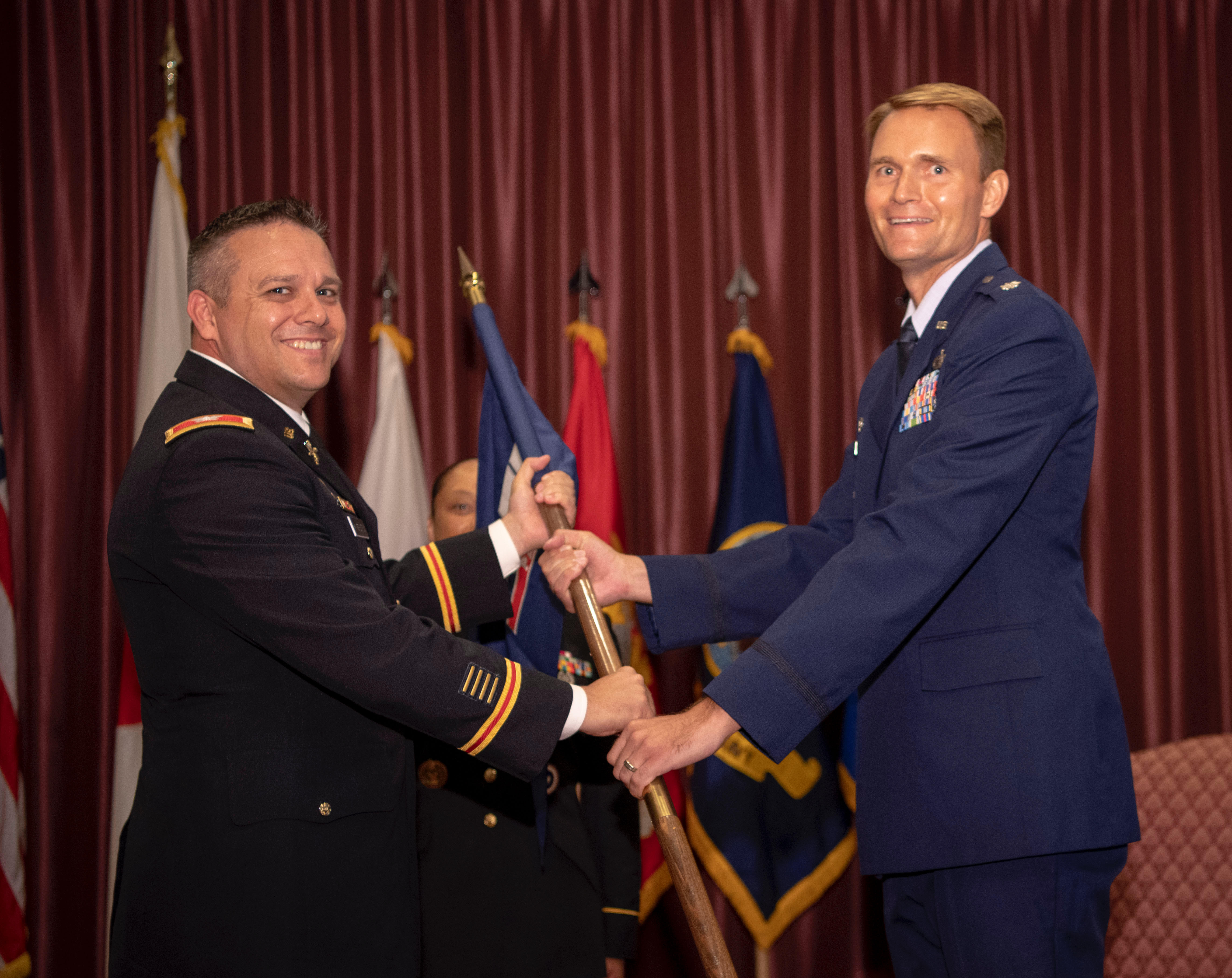 U.S. Army Col. Paul Haverstick, Defense Media Activity director, charges U.S. Air Force Lt. Col. Phil Ventura '00 with command of American Forces Network-Pacific at a ceremony on Yokota Air Base, Japan, Aug. 9, 2019.