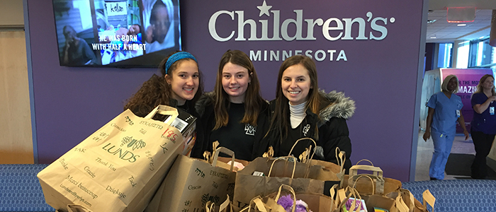 Kara Conrad '20, Annabelle Sullivan '20, and Lizzie Paterson '20 delivered the toys collected in the Holiday Hope toy drive.