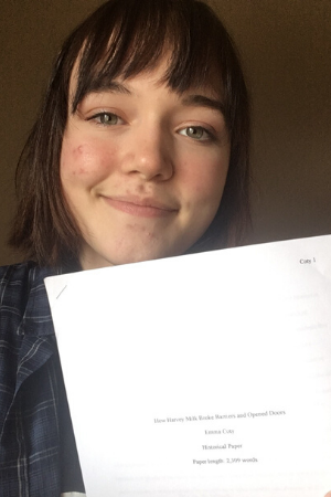Emma Coty '22 with her winning paper.