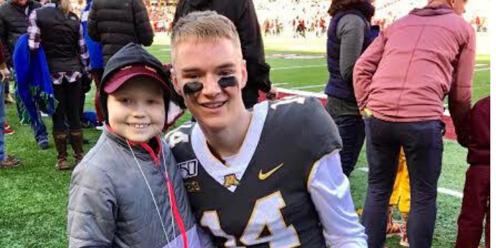 Casey O'Brien '17 with a young fan.