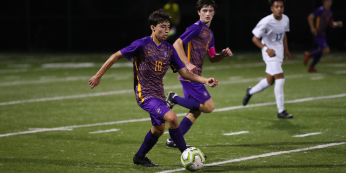 Mateo Castro '21 dribbles down the field in a game last year.