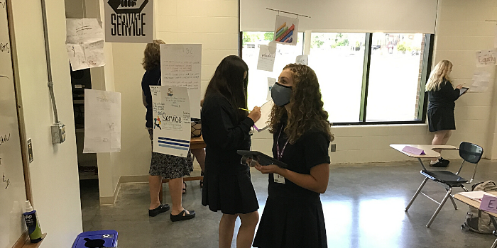 Students in MDM Values spend time observing the posters of their classmates displayed on mobiles as they create personal definitions of the seven CDH values: academic, Catholic, community, diversity, equity, leadership, and service. 