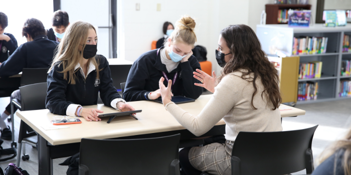 Social Studies teacher Morgan Lieske guides students through the History Day process.