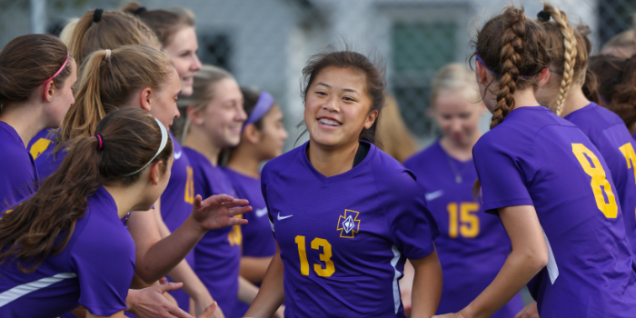 Aimee Fiedler '22 is cheered on by her team. Sports are a great way to make new friends at CDH.