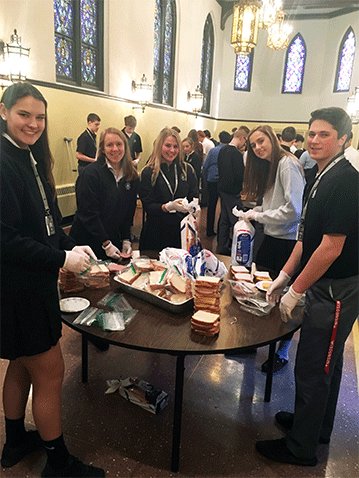 CASA students make sandwiches for the homeless in Saul Hall in the Sunberg Leadership Center.  2/21/17