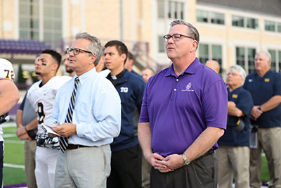 Totino Grace President, Craig Junker, and CDH President, Frank Miley during the ceremony's opening prayer.