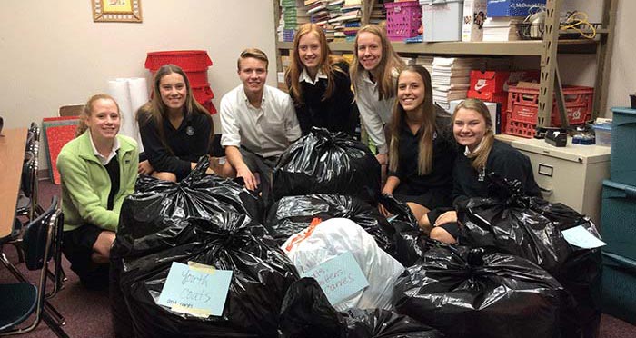 CDH students help organize donations from the 2016 Coat Drive
