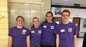 Members of the CDH Band help at the beverage table.