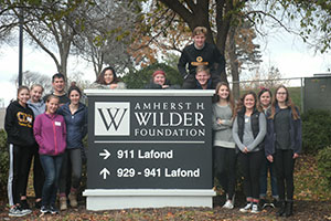 Students gather outside Wilder Foundation for a quick photo before a day of service.