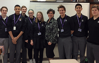 Zimmer, mother of Josie’11, Olivia’13, and Dominic’17 Lonetti, is pictured with juniors (L-R) Joe Sexton, Lucas Ammons, Ryan Milner, Allie Reding, Frances Miller, Henry Anderson, Nicholas Paredes Sepulveda, and Jacob George.