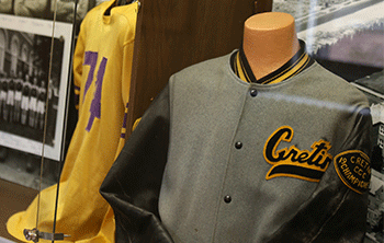 The displays feature memorabilia and photos from all three schools. 