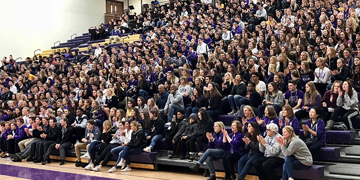 A large crowd listens to Principal Passman as she listed all of the state participants.