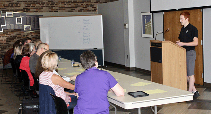 Senior Joe Seifert researched and presented his findings about microlending.