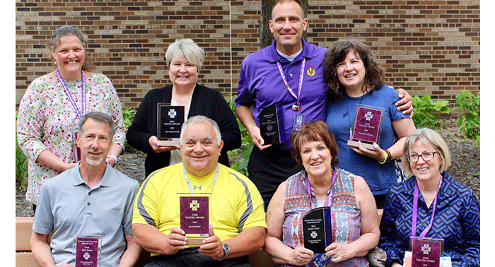 Pictured are some of the award recipients: (front row) Mark Syman, Dan Rosen, Mamie Fabel, Mary Robison and (back row) Carole Loufek, Patty Moellner, Jamie Fischer, Christina DeVos. Not pictured are Br. Hawkins, Jim O’Neill, Na Ye.