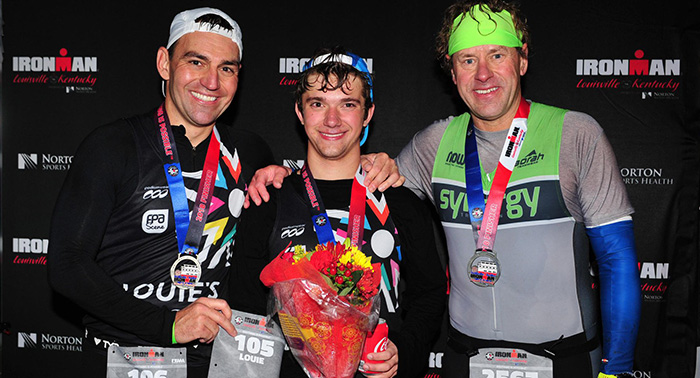 Milan Tomaska, Louie McGee '19, and, Steve Roeske at the Ironman Finish Line.