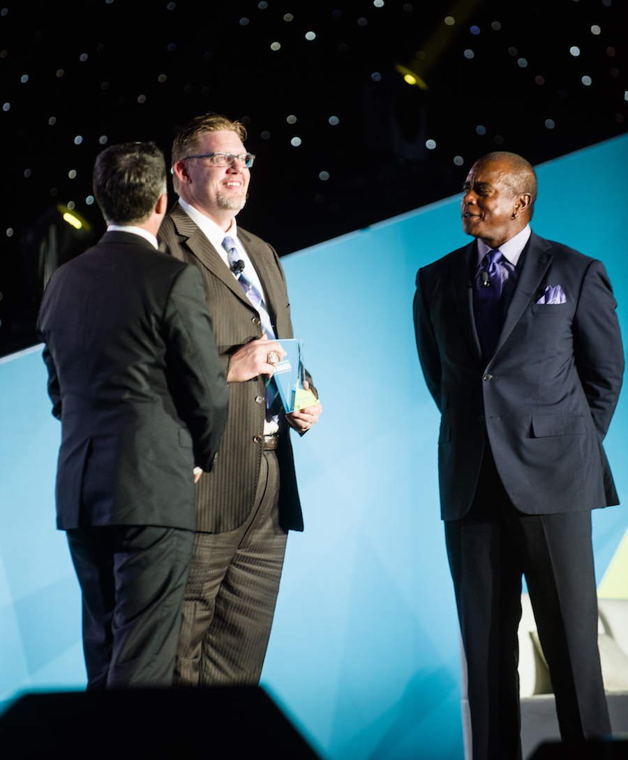 Copyright: Photo by Time Into Pixels Photography www.timeintopixels.com. Coach Kline accepts the award from Ahmad Rashad and Anthony LaPanta on behalf of all involved in this win.