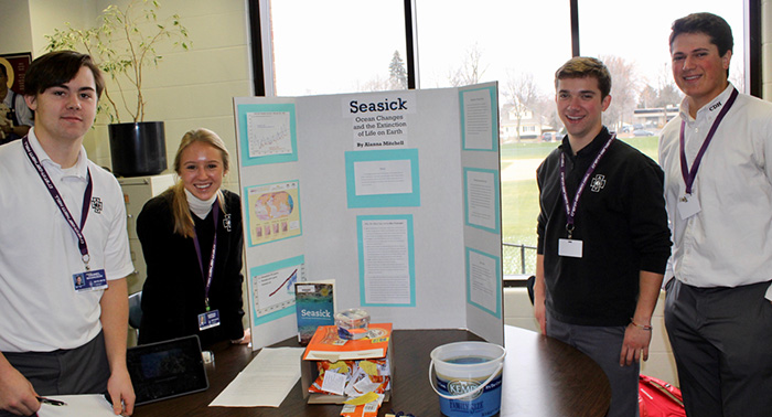 Seniors Daniel Magnuson, Abigail Reeder, Louie McGee, and Noah Peirson showcase their Seasick presentation, based on the book Seasick: Ocean Change and the Extinction of Life on Earth by Alanna Mitchell.